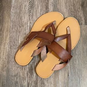 Brown faux leather flip flops